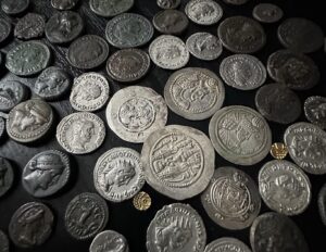 a big collection of different ancient coins