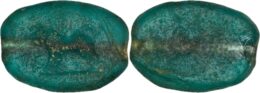 Ancient green glass intaglio featuring a carved boar motif, dated to the 1st-3rd century AD